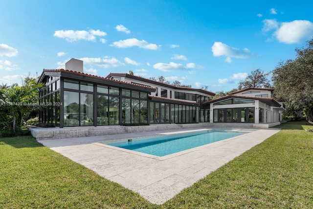 view of pool featuring a yard