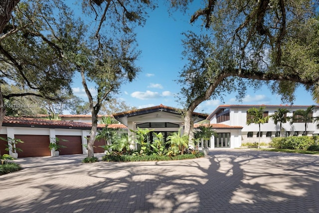 mediterranean / spanish house featuring a garage