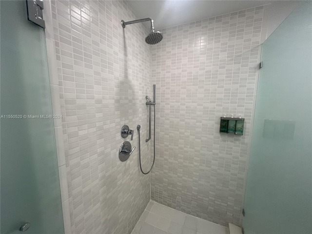 bathroom with a tile shower