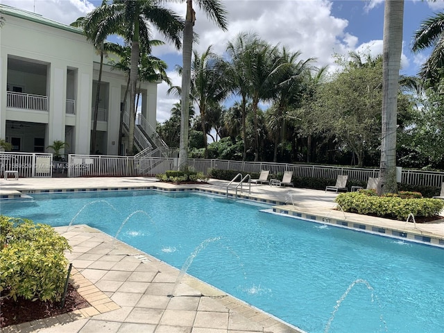 view of pool featuring a patio area and pool water feature