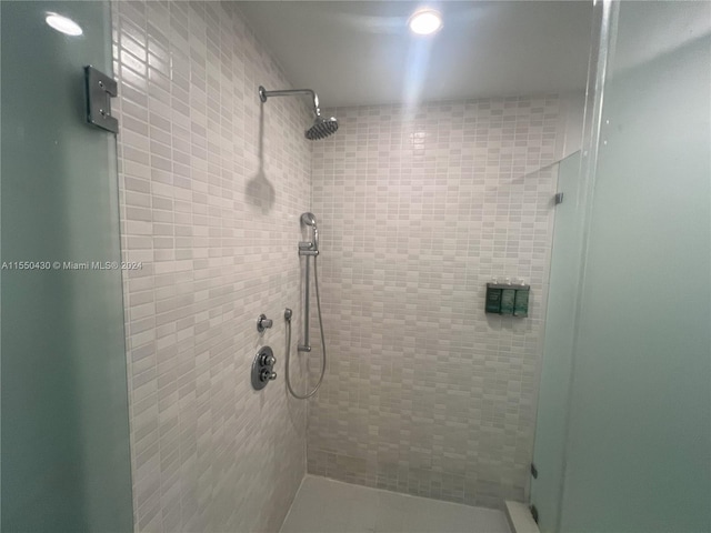 bathroom with a shower with shower door