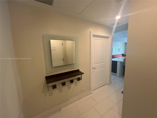 hallway with light tile patterned flooring