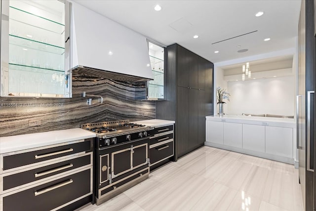 kitchen with light tile floors, custom exhaust hood, backsplash, and double oven range