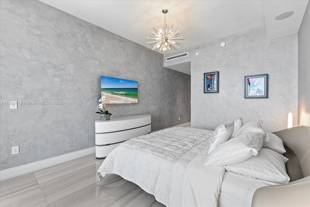 bedroom featuring an inviting chandelier