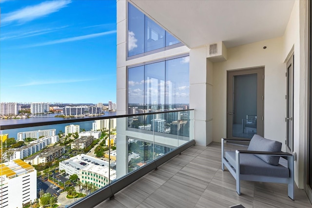 balcony featuring a water view