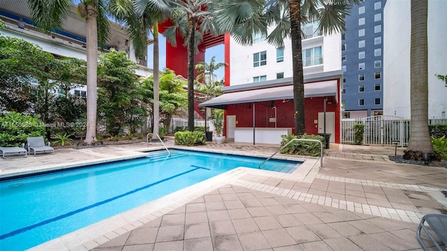 view of swimming pool featuring a patio area