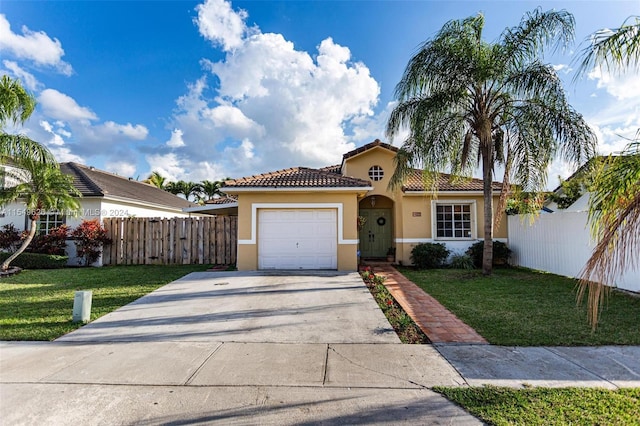 view of front of property featuring a garage and a front lawn