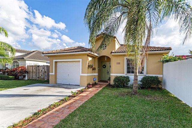 mediterranean / spanish home featuring a garage and a front yard