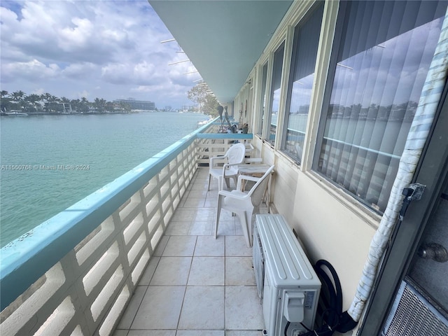 balcony featuring a water view