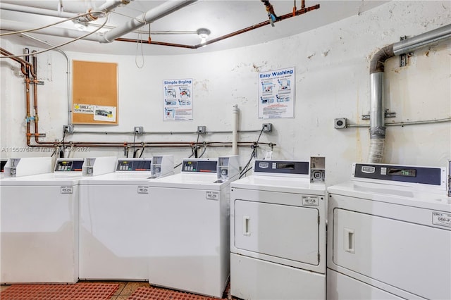 clothes washing area featuring washer and clothes dryer