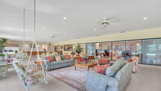 living room with ceiling fan and light tile patterned floors