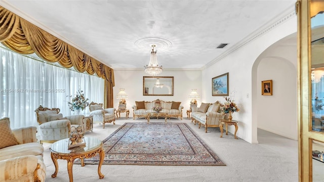 carpeted living room featuring a notable chandelier and ornamental molding