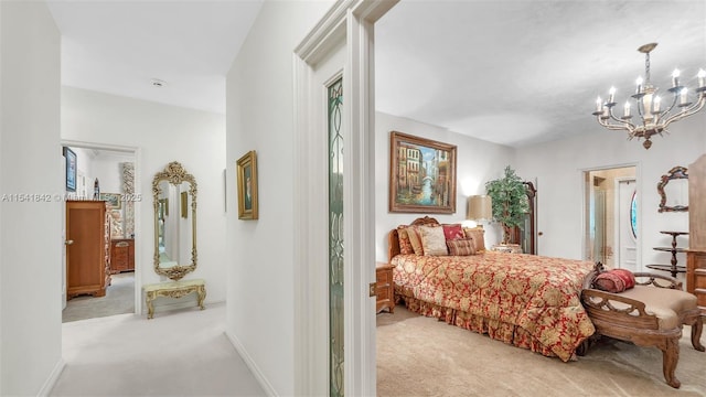 carpeted bedroom with a chandelier