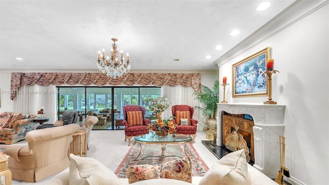 living room featuring crown molding, a chandelier, and a fireplace