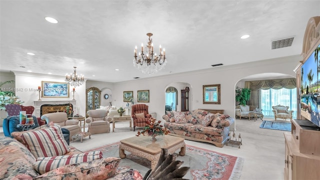 living room with crown molding, a high end fireplace, light carpet, and a chandelier