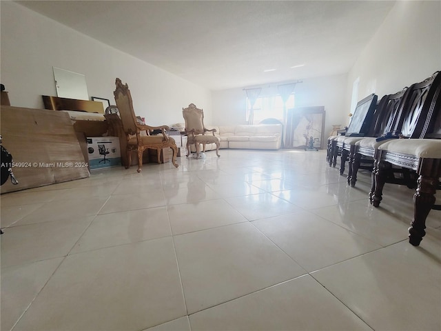 unfurnished room with light tile floors