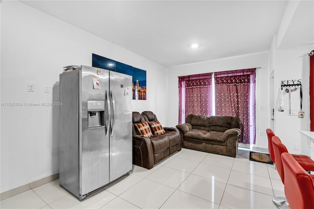 living room featuring light tile floors