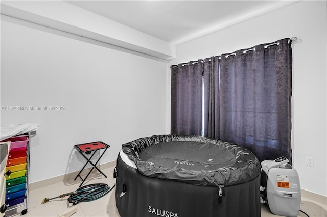 bedroom featuring light tile floors