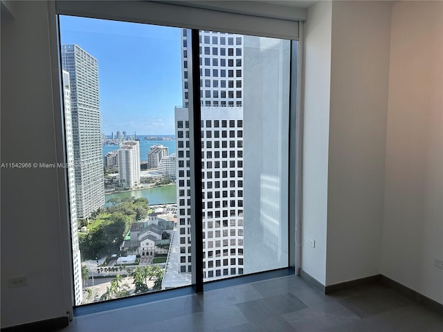 doorway to outside with a water view