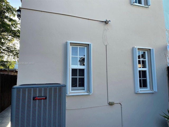 view of side of home featuring central air condition unit