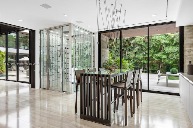 dining space featuring visible vents and floor to ceiling windows