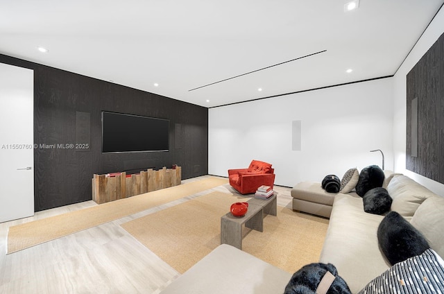 cinema room featuring an accent wall and recessed lighting