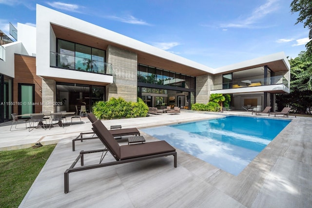 outdoor pool featuring a patio area