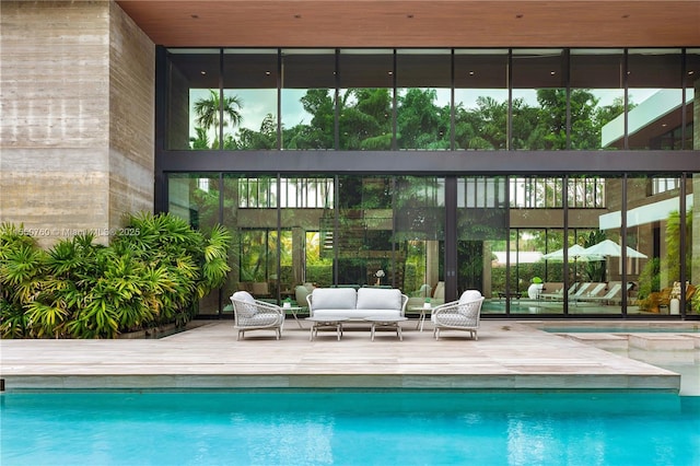 pool featuring outdoor lounge area