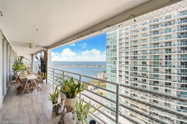 balcony featuring a water view