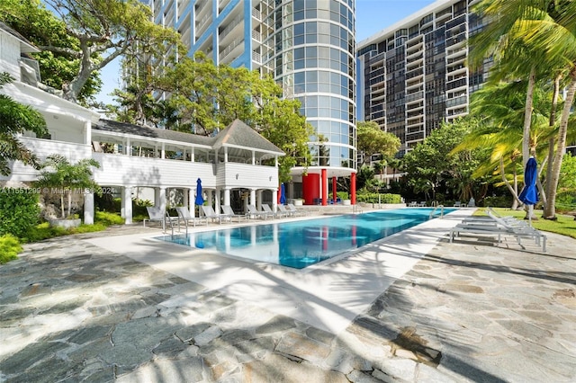 view of swimming pool featuring a patio area