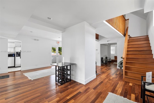 hallway featuring french doors and dark hardwood / wood-style floors