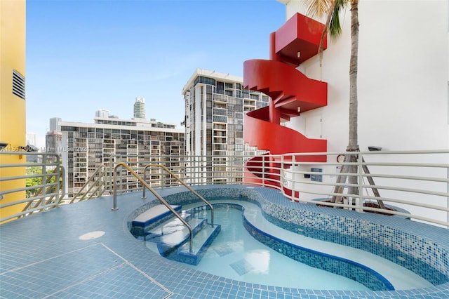 view of pool featuring a hot tub