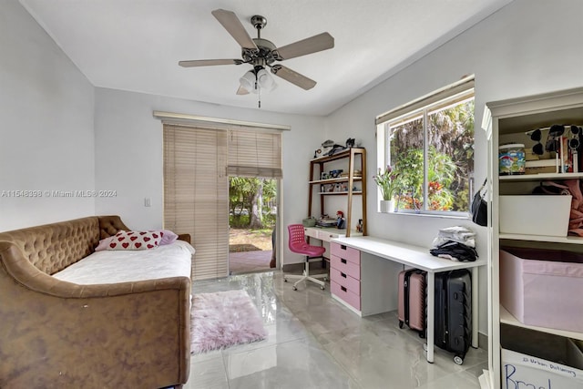 tiled home office featuring ceiling fan