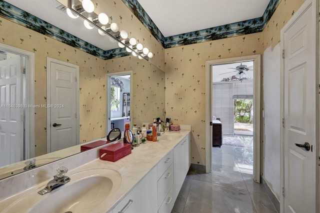 bathroom featuring large vanity, tile floors, and double sink