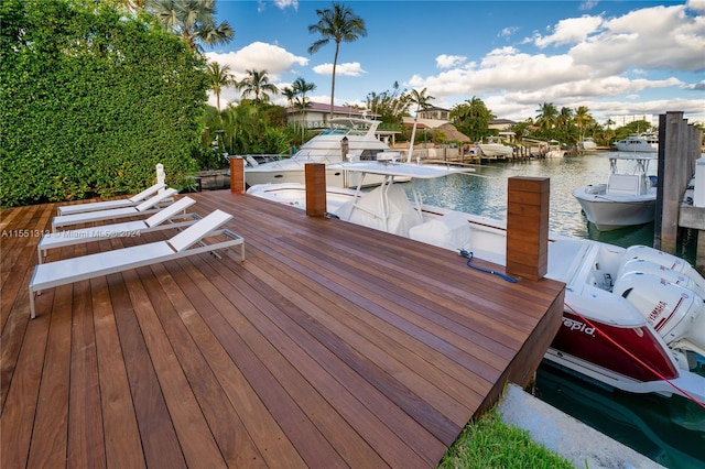 deck with a water view and a boat dock