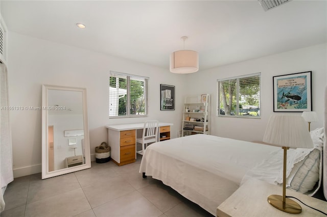 bedroom with light tile patterned flooring