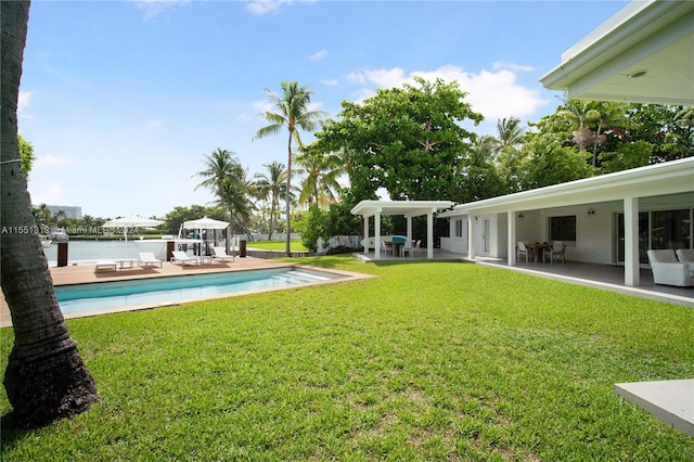 view of yard featuring a water view and a patio