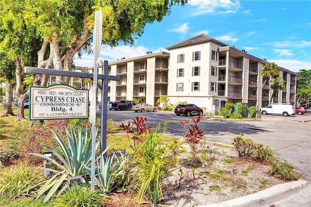 view of property featuring uncovered parking