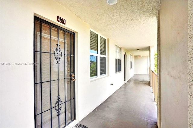 entrance to property featuring stucco siding