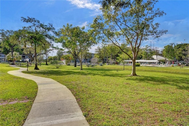 view of property's community with a yard