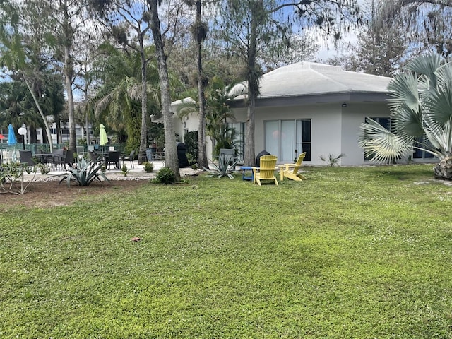 exterior space with a lawn and a patio