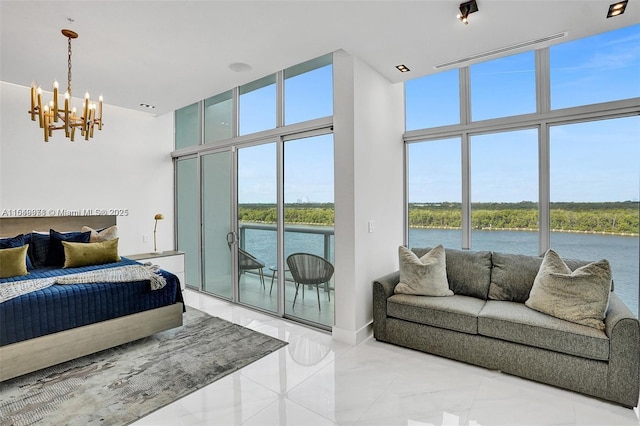 bedroom with a towering ceiling, expansive windows, access to outside, a notable chandelier, and a water view