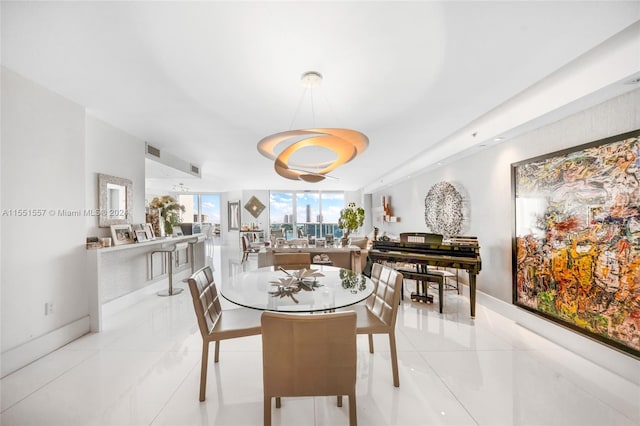 dining area with light tile floors