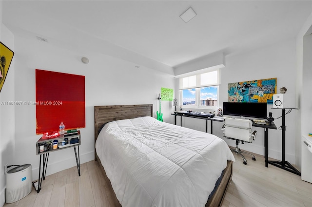 bedroom featuring light wood-type flooring