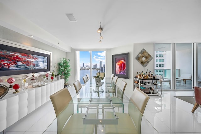 tiled dining space with expansive windows