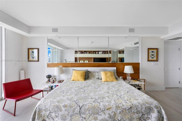 bedroom featuring light wood-type flooring