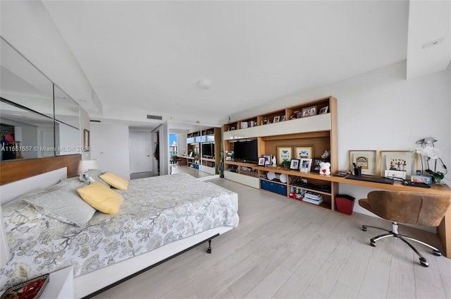 bedroom with light hardwood / wood-style floors