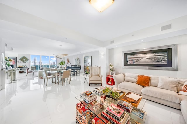 living room featuring light tile floors