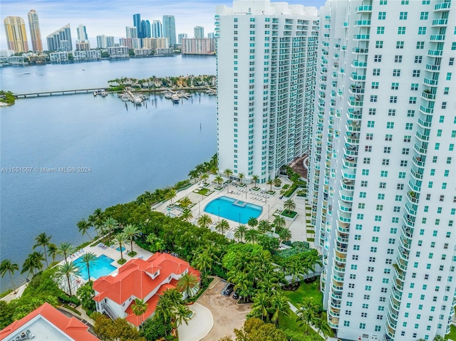 birds eye view of property with a water view