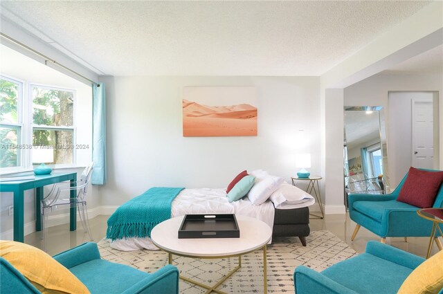 living room with a textured ceiling